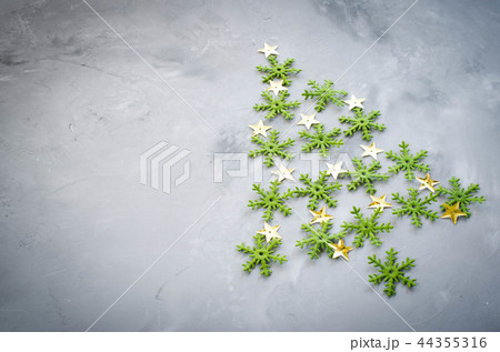 Decorative Christmas tree on a gray background. Decorative Christmas tree on a gray background. 44355316