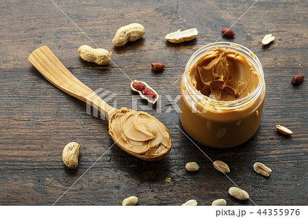 peanut butter in an open jar peanut butter in an open jar 44355976