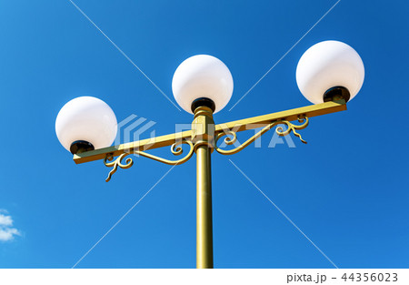 Street lamp against the blue sky 44356023