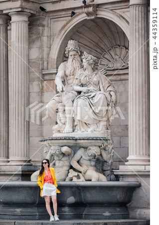 Woman walking in city. Young attractive tourist outdoors in italian city Woman walking in city. Young attractive tourist outdoors in italian city 44359114
