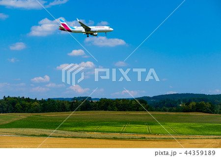Eurowings airlines airplane preparing for landing at day time in international airport 44359189