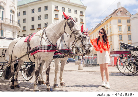 Woman walking in city. Young attractive tourist outdoors in italian city Woman walking in city. Young attractive tourist outdoors in italian city 44359297