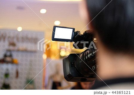 video production camera recording live event on stage. television social media broadcasting seminar conference. 44365121