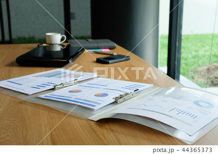 computer document on wood office desk near window. working space concept computer document on wood office desk near window. working space concept 44365373