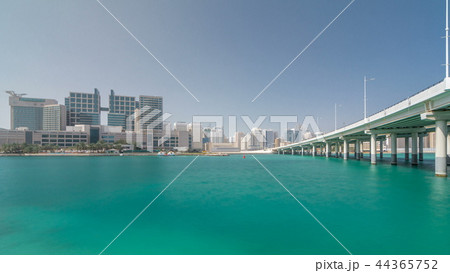 Modern buildings in Abu Dhabi skyline timelapse hyperlapse with mall and beach. 44365752