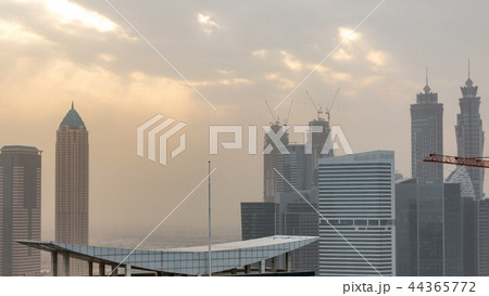 Dubai business bay towers at sunset aerial timelapse. 44365772