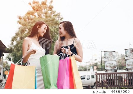 Two beautiful asian female friends standing 44367009