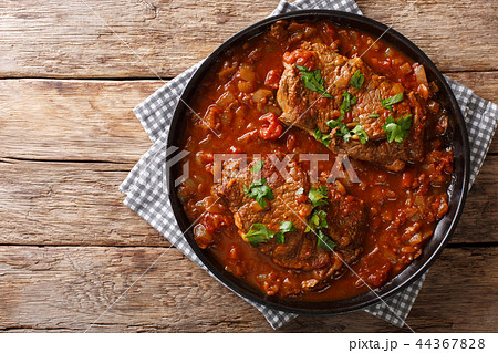 Smothered food Swiss steak in a spicy tomato sauce 44367828