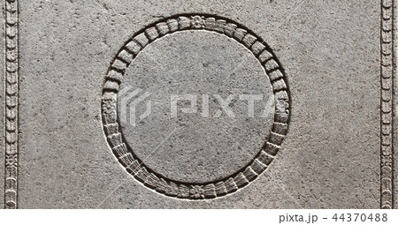 Detail of an ancient carved stone frame  44370488