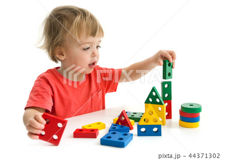 Little boy playing with colorful block Little boy playing with colorful block 44371302