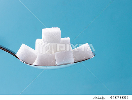 Sugar on blue background Sugar on blue background 44373395