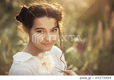 Beautiful carefree woman in fields being happy outdoors 44373994