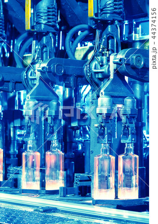 Hot rolled ribbed bottles on conveyor Hot rolled ribbed bottles on conveyor 44374156