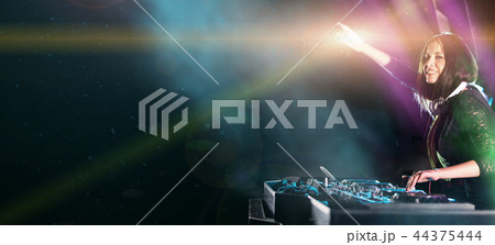 Dj mixes the track in the nightclub at a party 44375444