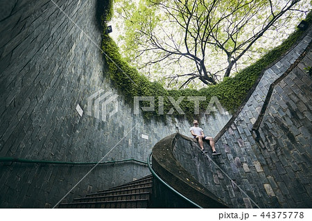 Lonely man on the spiral staircase Lonely man on the spiral staircase 44375778