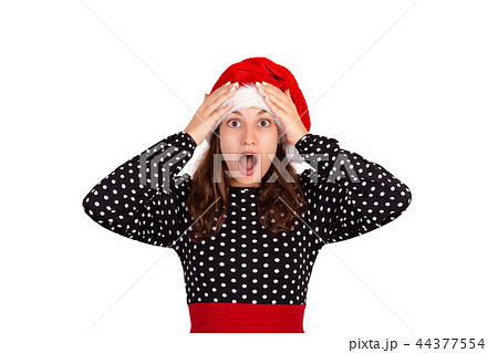emotional girl in santa christmas hat isolated 44377554