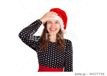 emotional girl in santa christmas hat isolated 44377730
