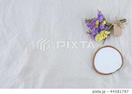 White blank wood with statice flowers 44381797