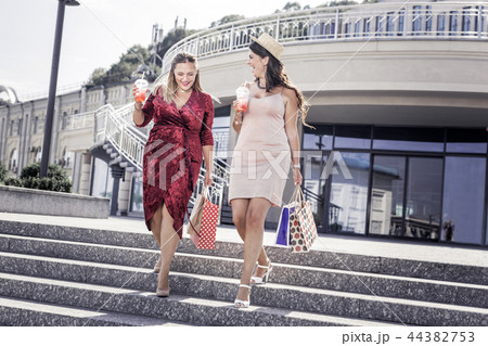 Delighted nice women going down the stairs 44382753