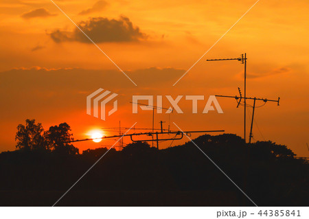 Silhouette of sunset with television antenna. Silhouette of sunset with television antenna. 44385841