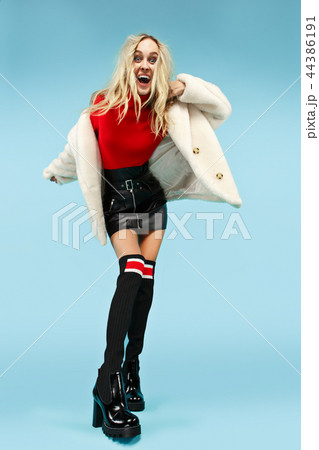 Full-length portrait young elegant woman at studio. Female fashion and shopping concept Full-length portrait young elegant woman at studio. Female fashion and shopping concept 44386191