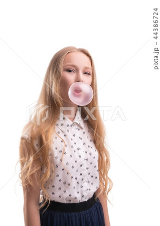 Pretty teenaged girl with bubble gum portrait Pretty teenaged girl with bubble gum portrait 44386724