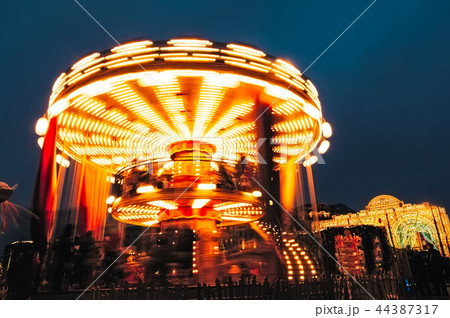 Luminous roundabout rotates with adults childrens Luminous roundabout rotates with adults childrens 44387317