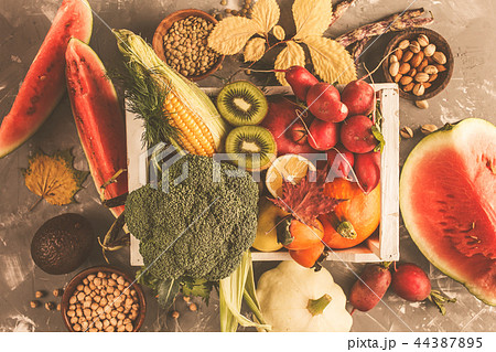 Autumn harvest in a wooden box. Fruits, vegetables 44387895