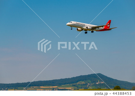 Helvetic Swiss airlines airplane preparing for landing at day time in international airport 44388453