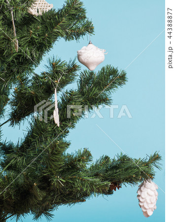 close up on Christmas tree and Christmas decorations on blue background 44388877