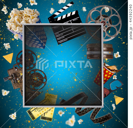 Cinema concept of vintage film reels, clapperboard and projector. 44392240