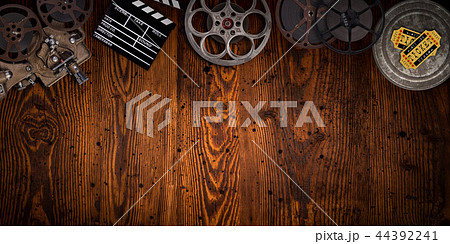Cinema concept of vintage film reels, clapperboard and projector. Cinema concept of vintage film reels, clapperboard and projector. 44392241