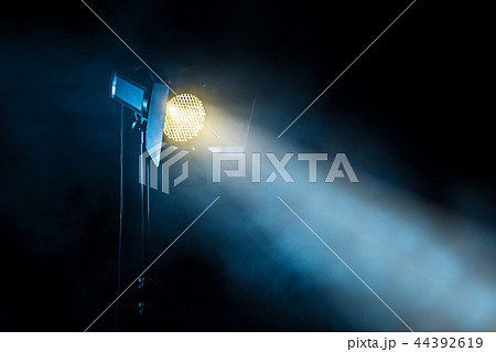Theater spot light on black background. 44392619