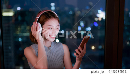 woman use phone listen music woman use phone listen music 44393561