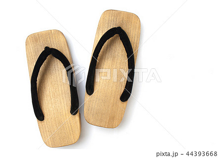 Old wooden Japanese sandal on white background. Old wooden Japanese sandal on white background. 44393668