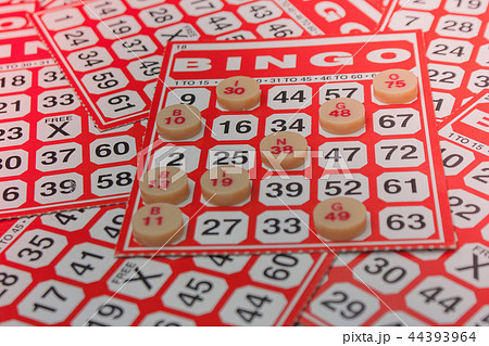 Red bingo card with white chip. Red bingo card with white chip. 44393964