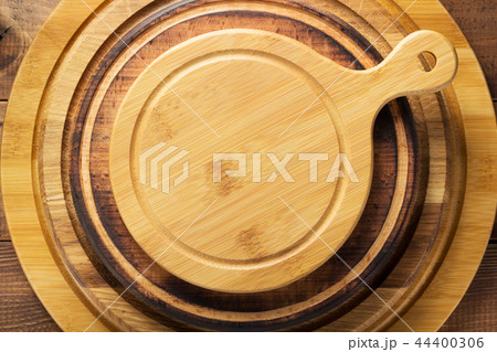 pizza or bread cutting board at wooden table pizza or bread cutting board at wooden table 44400306