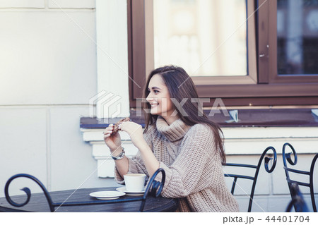 young woman at a coffee shop 44401704