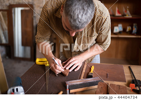 A joiner using his chisel A joiner using his chisel 44404734