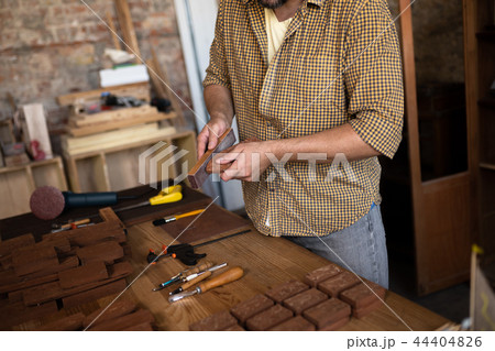 Close-up view on the work of a wood carpenter Close-up view on the work of a wood carpenter 44404826