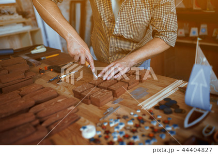 Close-up view on the work of a wood carpenter Close-up view on the work of a wood carpenter 44404827