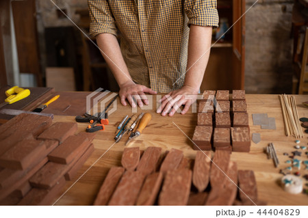 Close-up view of a wood carpenter's hands 44404829