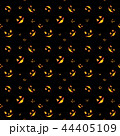 Pattern of many orange eyes of angry faces of pumpkins in darkness. 44405109