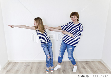 Beautiful mother and daughter on white Beautiful mother and daughter on white 44407542