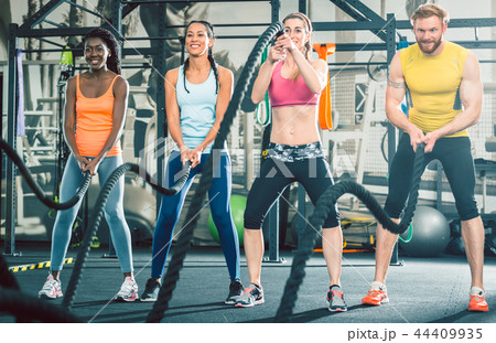 Determined and strong cheerful people during functional training 44409935