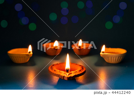 Happy Diwali - Clay Diya lamps lit during Dipavali 44412240