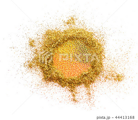 A circle of gold glitter on a white background with a fluorescent center. A circle of gold glitter on a white background with a fluorescent center. 44413168