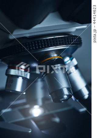 Modern microscope with metal lens at laboratory. Modern microscope with metal lens at laboratory. 44414623