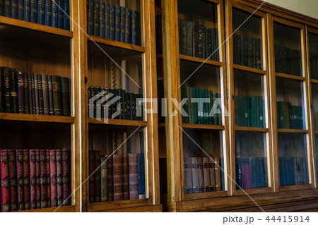 Old books in wooden row library 44415914