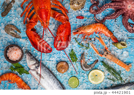 Fresh tasty seafood served on old wooden table. 44421901